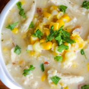 closeup overhead of about 2/3 of a bowl of this corn chowder in a white bowl